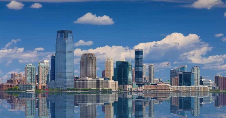 The Jersey City skyline reflected on water