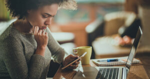 Woman looking at an update from her home security system app